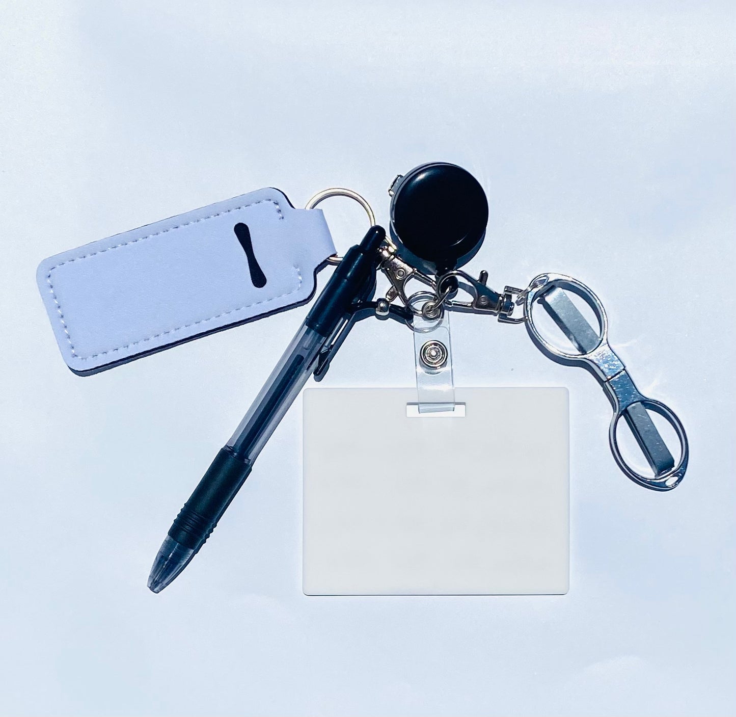 Erasable, reusable badge note with mini scissors, ballpoint pen, chapstick holder all attached to badge reel. Complete set gift idea for healthcare professionals, educators, office staff and more. BADGENOTE.COM