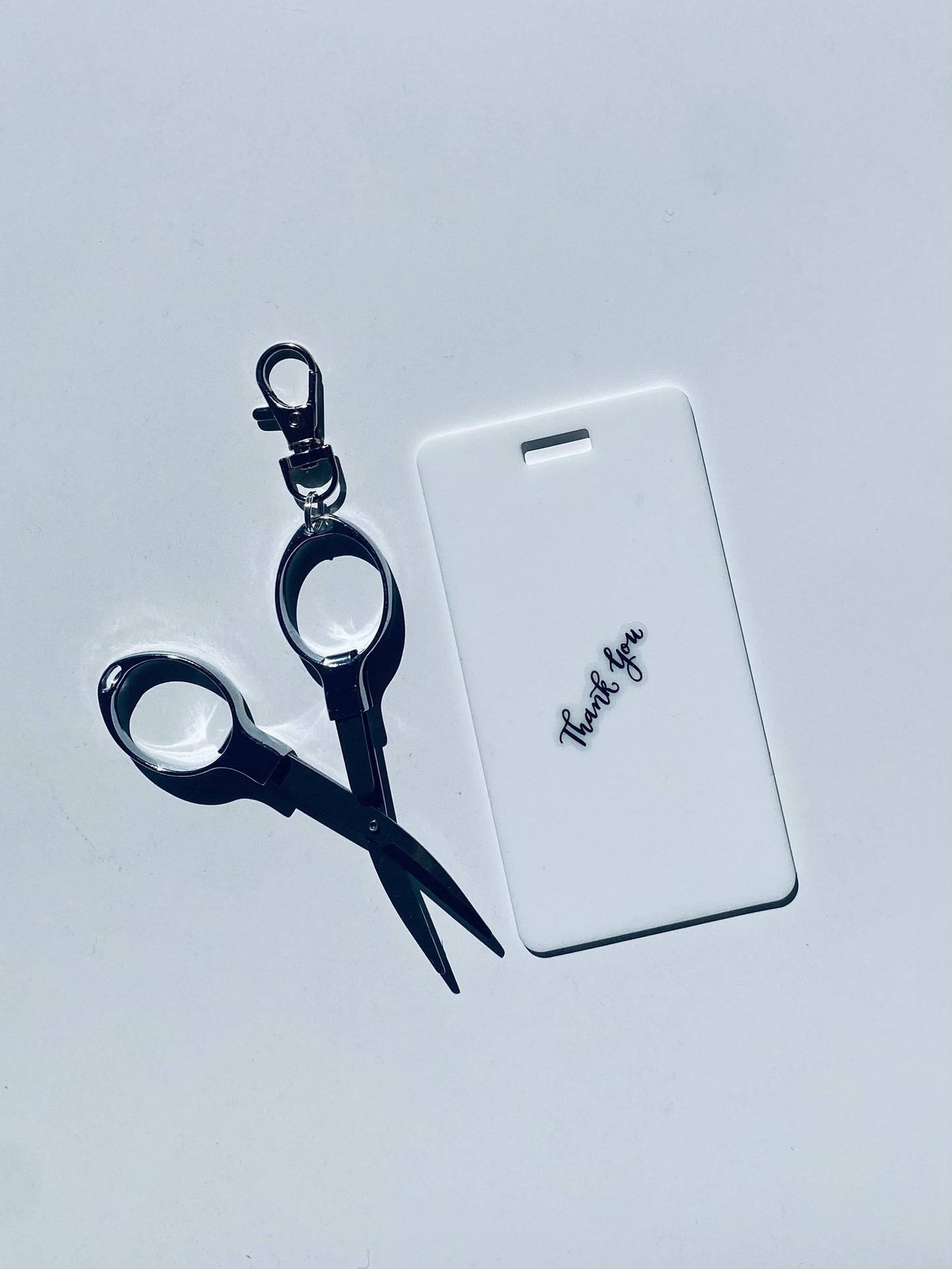 Vertical erasable badge with mini Scissors is the perfect pocket-sized accessory for healthcare professionals. Easily write on it with ballpoint pen, wipe it clean with alcohol pad, and reuse. Made of lightweight soft silicone, it's a nurse's essential for taking notes on the go. Attach it to your ID badge for convenience. ATTENTION: Gel &amp; super smooth/colored ink will smudge and may leave faint stains. www.badgenote.com