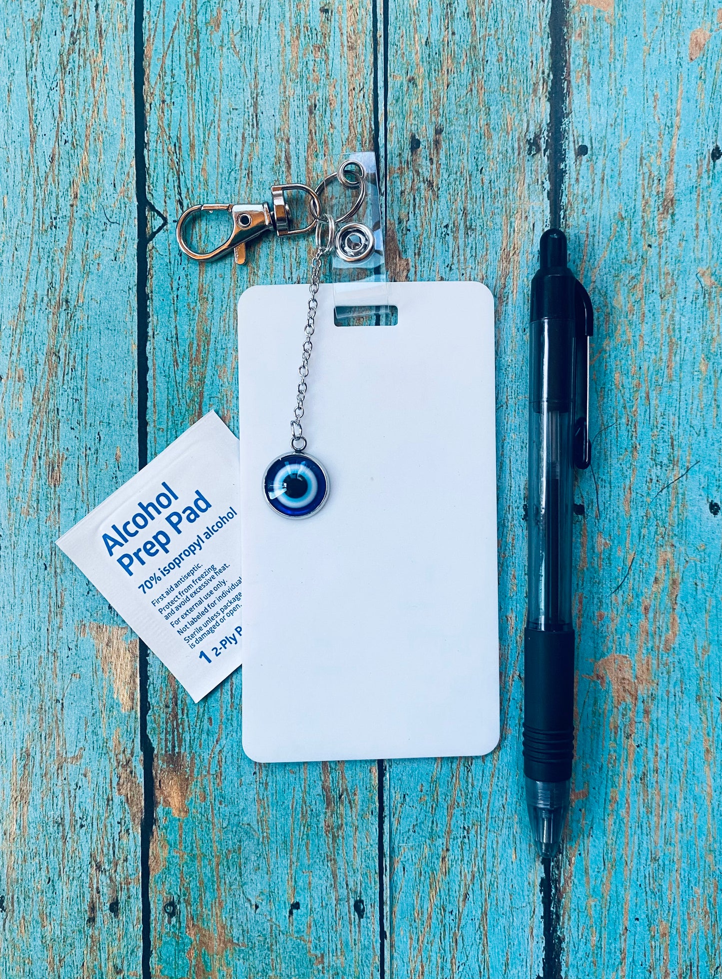 Keep your shopping list handy with this vertical reusable erasable badge note designed for keychains. Simply write using a ballpoint pen, erase with an alcohol pad, and reuse as needed. It easily clips onto your keys or purse, ensuring your list is always within reach. Please note, gel ink may smudge, and some very smooth ballpoint inks could leave faint marks. This practical accessory offers a reliable way to stay organized on the go.