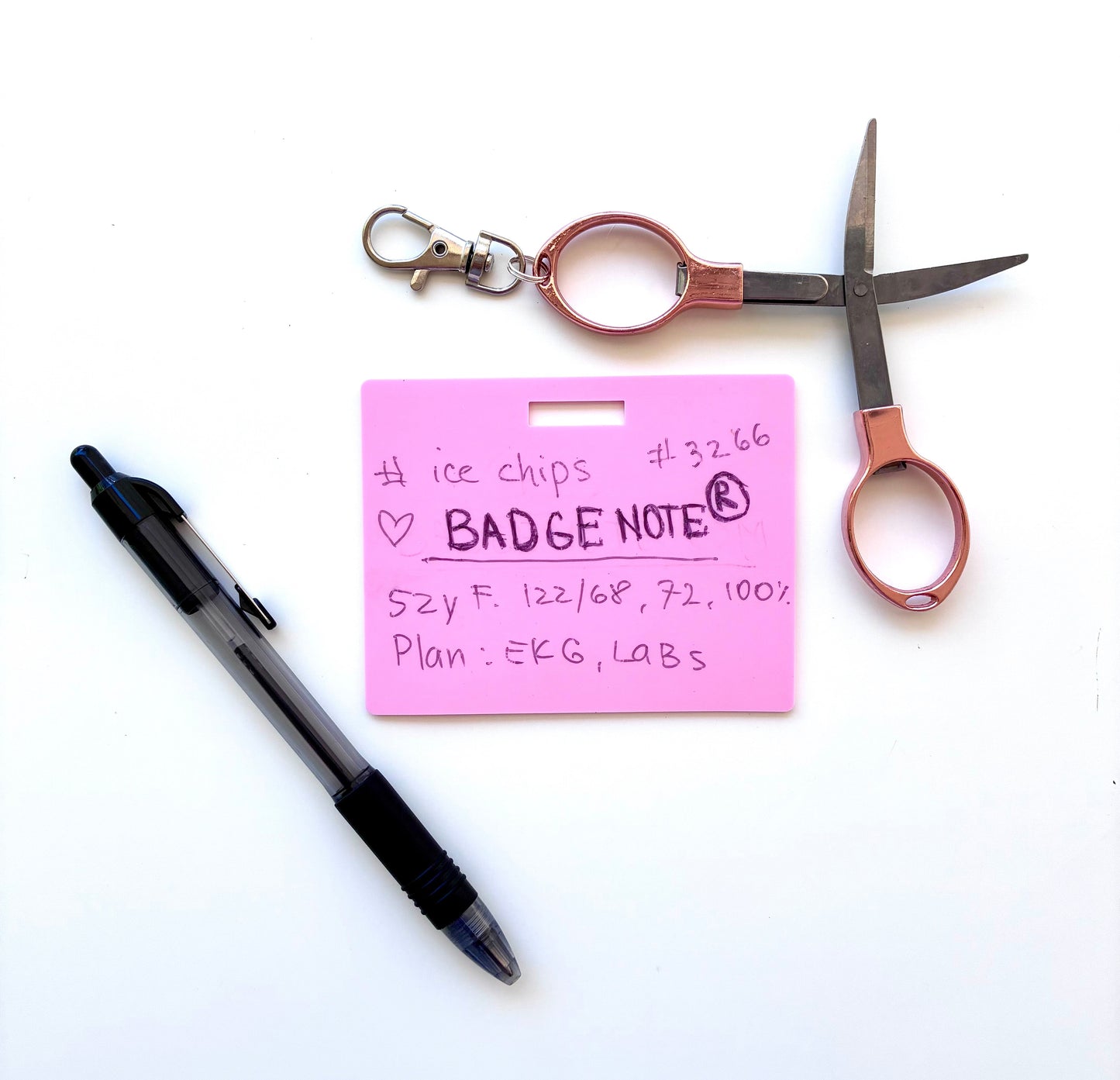 This practical badge note bundle pairs a horizontal design with a ballpoint pen (black ink) and compact folded scissors—ideal for healthcare professionals, educators, and office environments. The reusable surface accepts standard ballpoint ink and wipes clean with an alcohol pad for repeated use. Note that gel and certain smooth ballpoint formulations may leave residual marks; we recommend testing your preferred pen before regular use to ensure optimal performance and appearance. BADGENOTE.COM