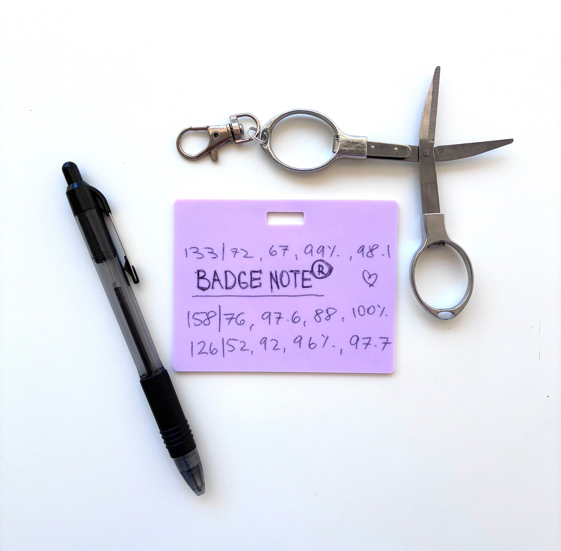 This practical badge note bundle pairs a horizontal design with a ballpoint pen (black ink) and compact folded scissors—ideal for healthcare professionals, educators, and office environments. The reusable surface accepts standard ballpoint ink and wipes clean with an alcohol pad for repeated use. Note that gel and certain smooth ballpoint formulations may leave residual marks; we recommend testing your preferred pen before regular use to ensure optimal performance and appearance. BADGENOTE.COM