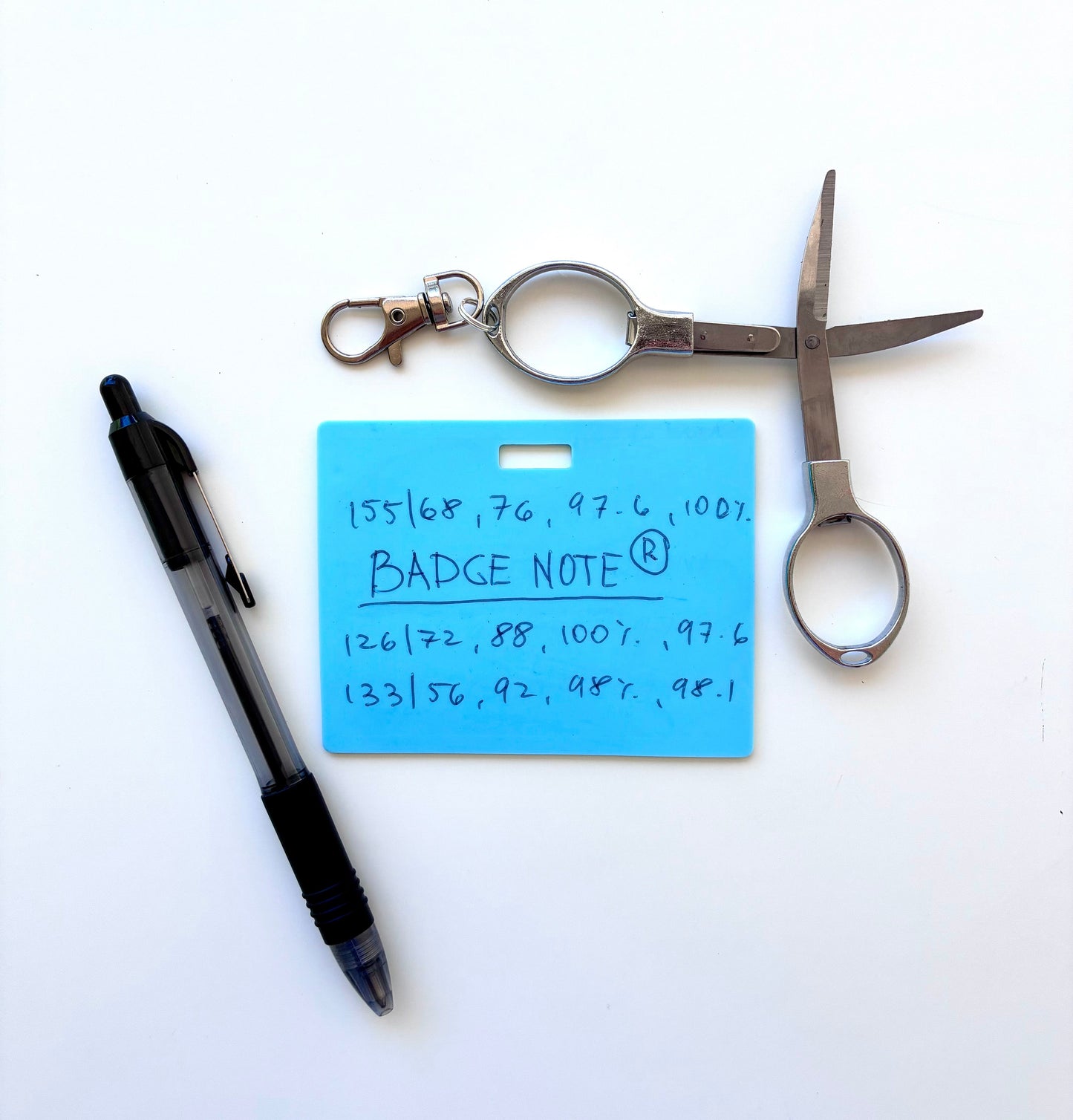 This practical badge note bundle pairs a horizontal design with a ballpoint pen (black ink) and compact folded scissors—ideal for healthcare professionals, educators, and office environments. The reusable surface accepts standard ballpoint ink and wipes clean with an alcohol pad for repeated use. Note that gel and certain smooth ballpoint formulations may leave residual marks; we recommend testing your preferred pen before regular use to ensure optimal performance and appearance. BADGENOTE.com