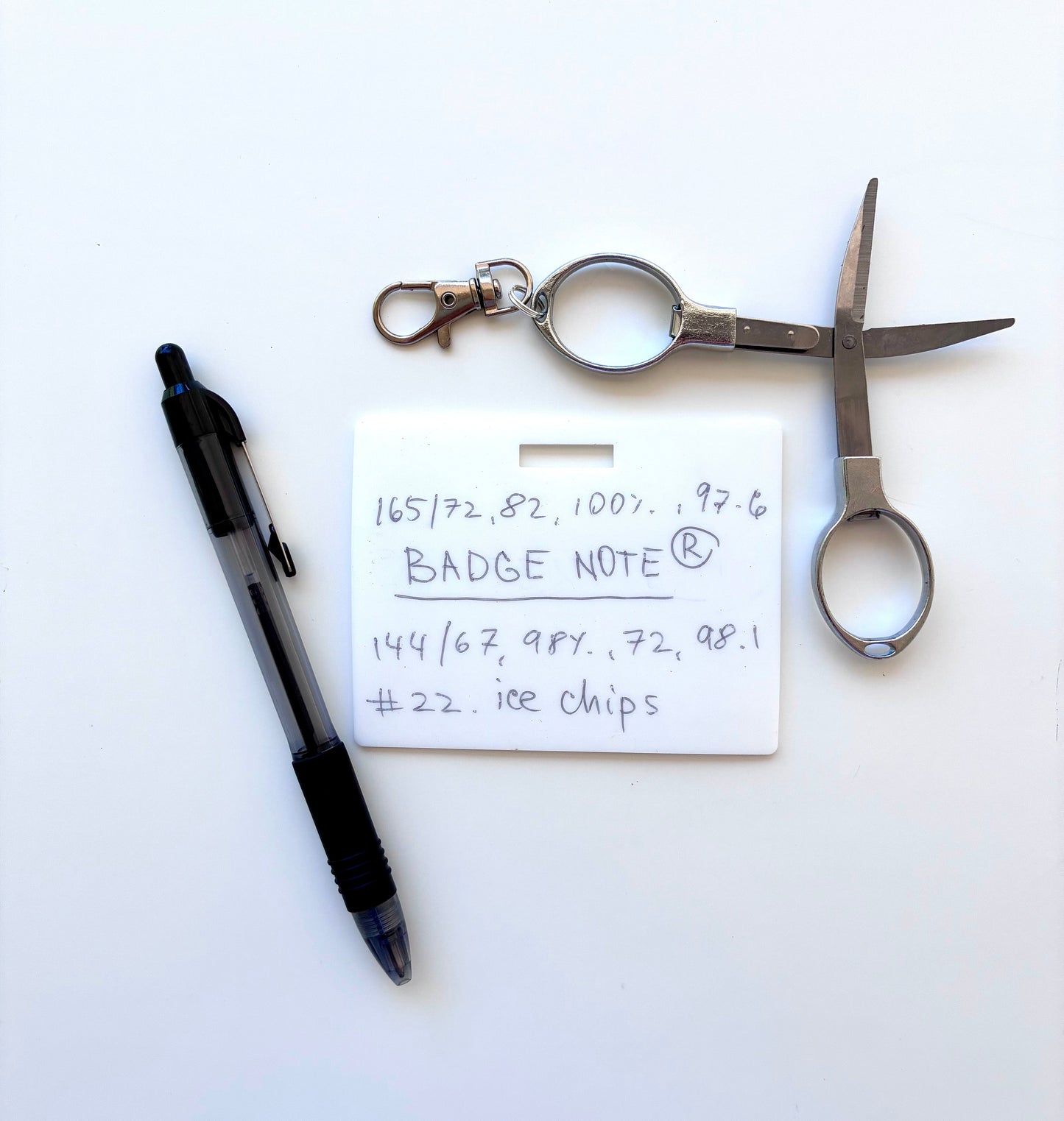 This practical badge note bundle pairs a horizontal design with a ballpoint pen (black ink) and compact folded scissors—ideal for healthcare professionals, educators, and office environments. The reusable surface accepts standard ballpoint ink and wipes clean with an alcohol pad for repeated use. Note that gel and certain smooth ballpoint formulations may leave residual marks; we recommend testing your preferred pen before regular use to ensure optimal performance and appearance.