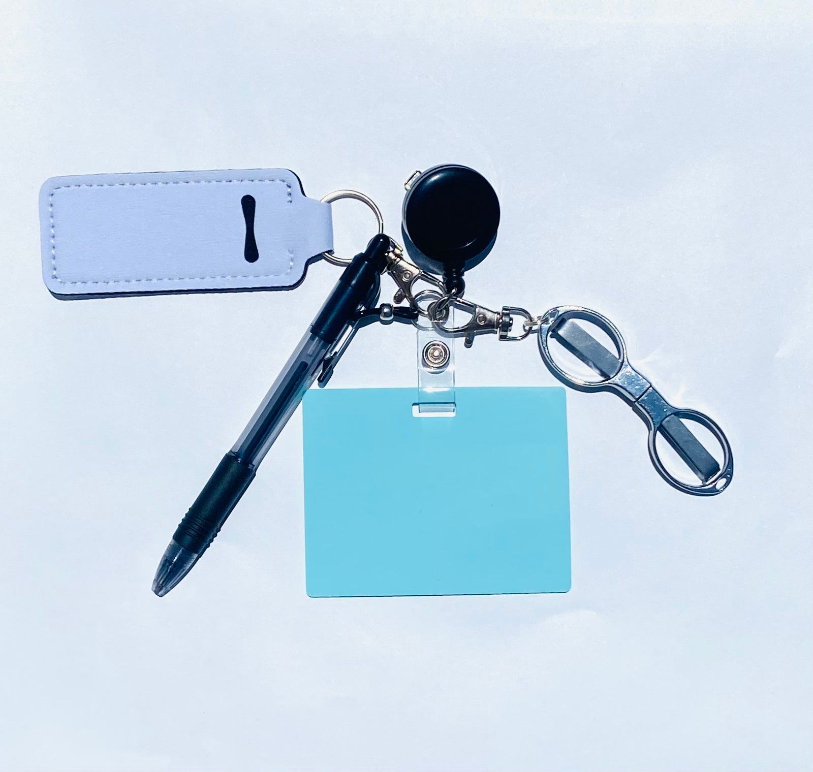 Erasable, reusable badge note with mini scissors, ballpoint pen, chapstick holder all attached to badge reel. Complete set gift idea for healthcare professionals, educators, office staff and more. BADGENOTE.COM