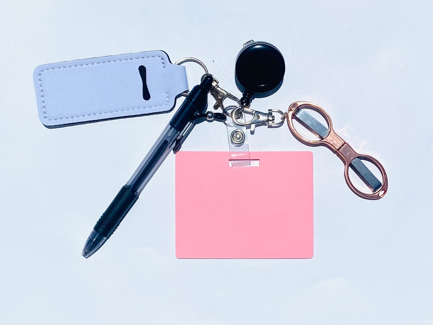 Erasable, reusable badge note with mini scissors, ballpoint pen, chapstick holder all attached to badge reel. Complete set gift idea for healthcare professionals, educators, office staff and more. BADGENOTE.COM