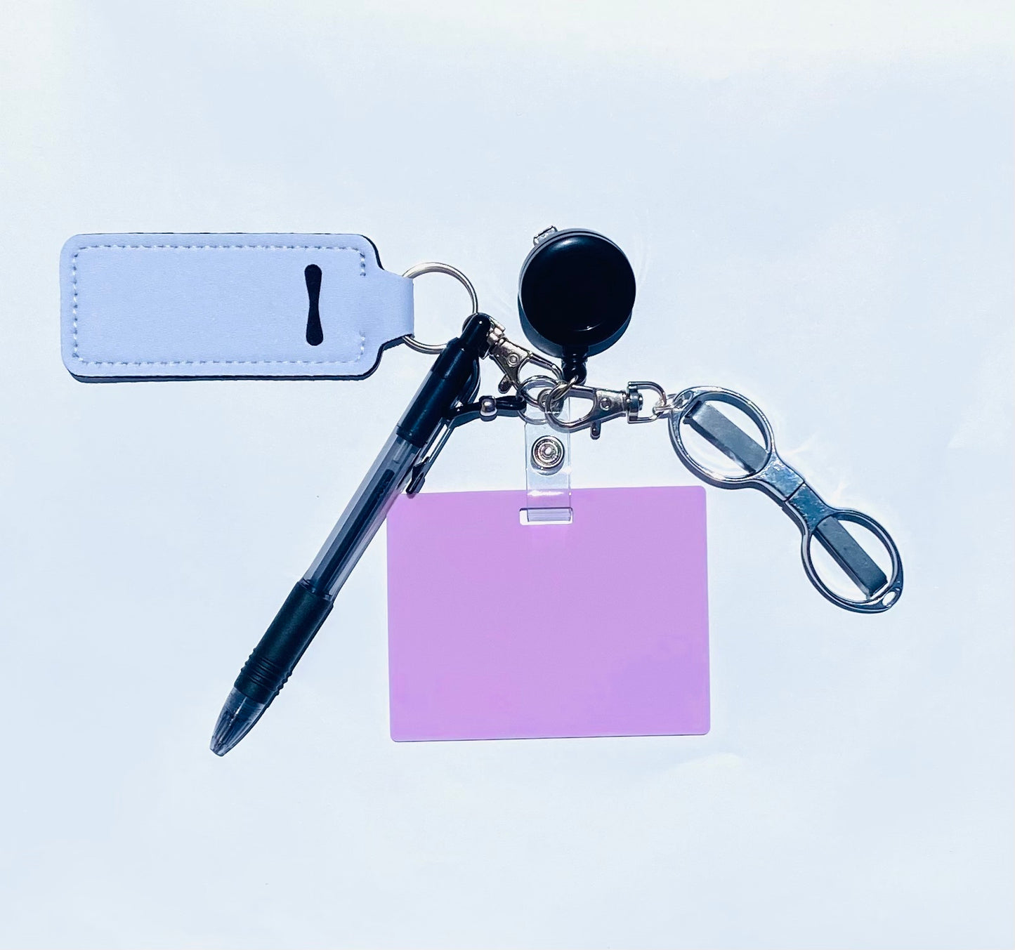 Erasable, reusable badge note with mini scissors, ballpoint pen, chapstick holder all attached to badge reel. Complete set gift idea for healthcare professionals, educators, office staff and more. BADGENOTE.COM