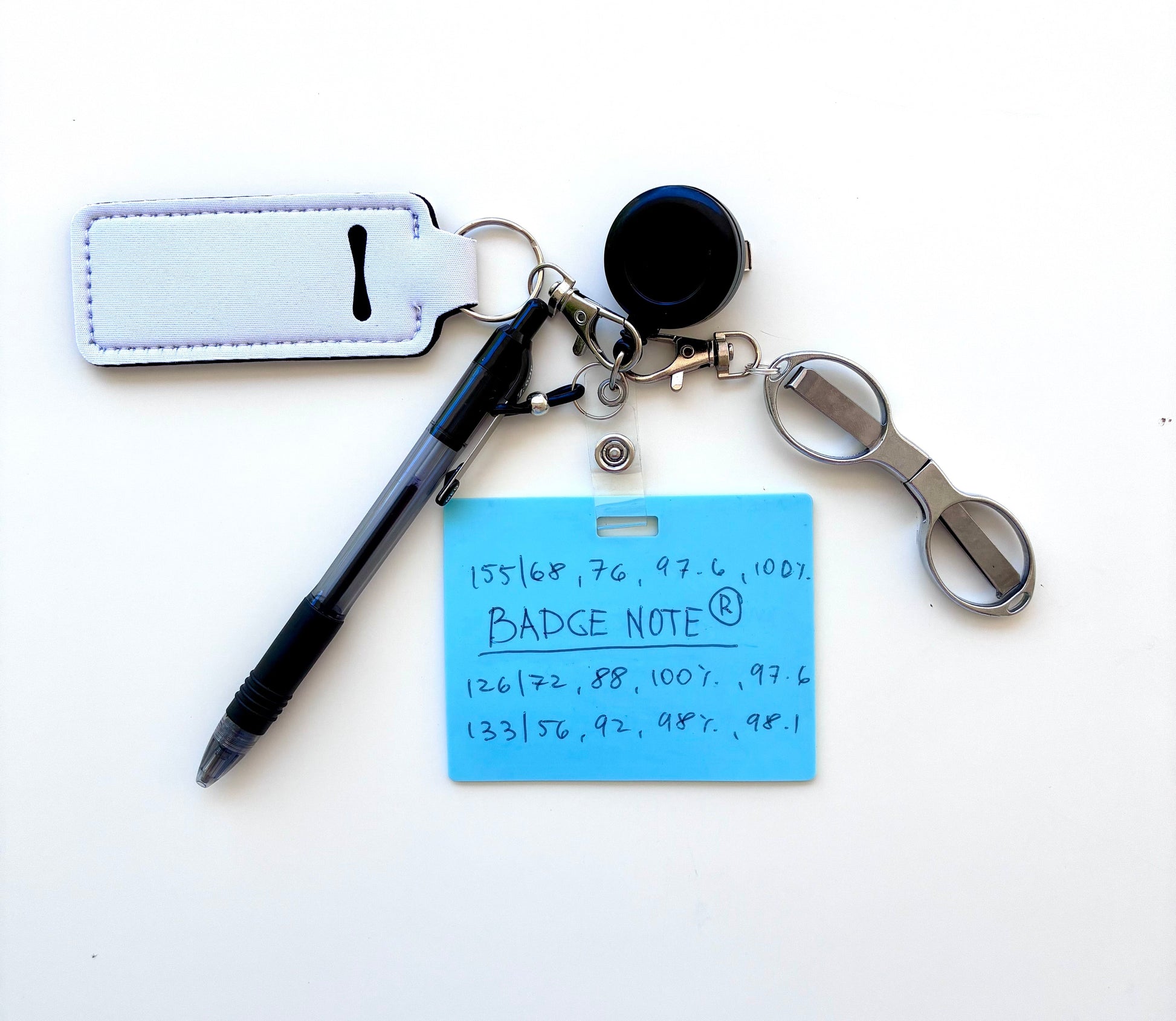 Erasable, reusable badge note with mini scissors, ballpoint pen, chapstick holder all attached to badge reel. Complete set gift idea for healthcare professionals, educators, office staff and more. BADGENOTE.COM