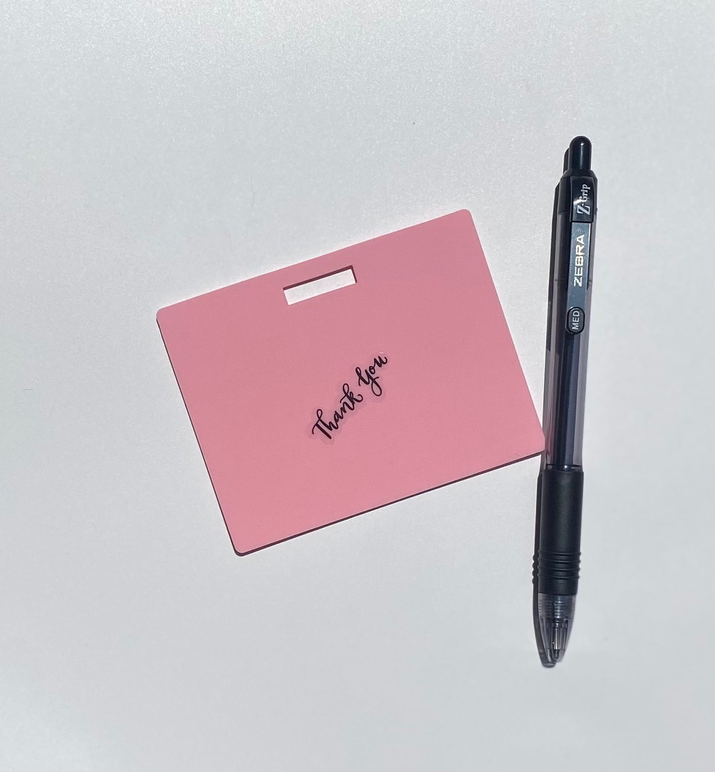 Ballpoint pen included. Horizontal erasable badge is the perfect pocket-sized accessory for healthcare professionals. Easily write on it with ballpoint pen, wipe it clean with alcohol pad, and reuse. Made of lightweight soft silicone, it's a nurse's essential for taking notes on the go. Attach it to your ID badge for convenience. ATTENTION: Gel &amp; super smooth/colored ink will smudge and may leave faint stains. www.badgenote.com