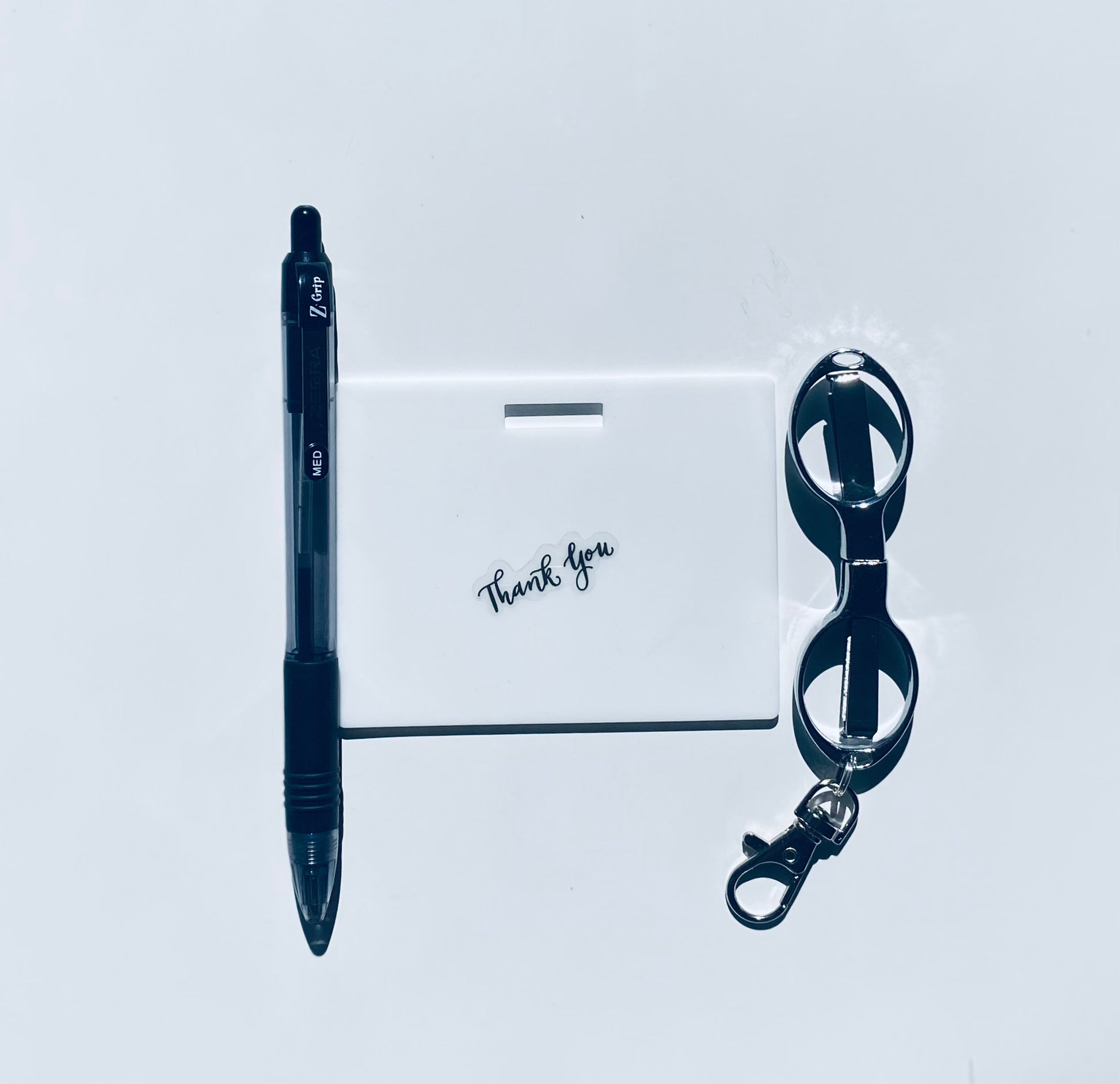 Ballpoint Zebra pen (black ink), horizontal badge note, mimi folded scissors. www.badgenote.com   