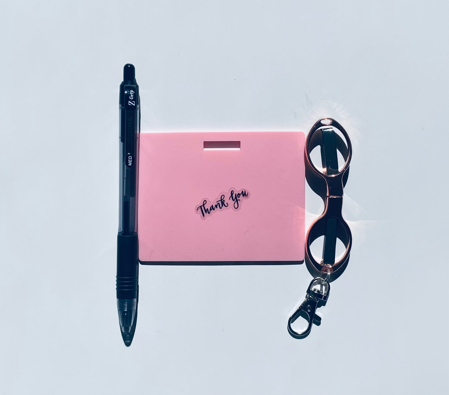 This practical badge note bundle pairs a horizontal design with a reliable Zebra Z-Grip ballpoint pen (black ink) and compact folded scissors—ideal for healthcare professionals, educators, and office environments. The reusable surface accepts standard ballpoint ink and wipes clean with an alcohol pad for repeated use. Note that gel and certain smooth ballpoint formulations may leave residual marks; we recommend testing your preferred pen before regular use to ensure optimal performance and appearance.&nbsp;