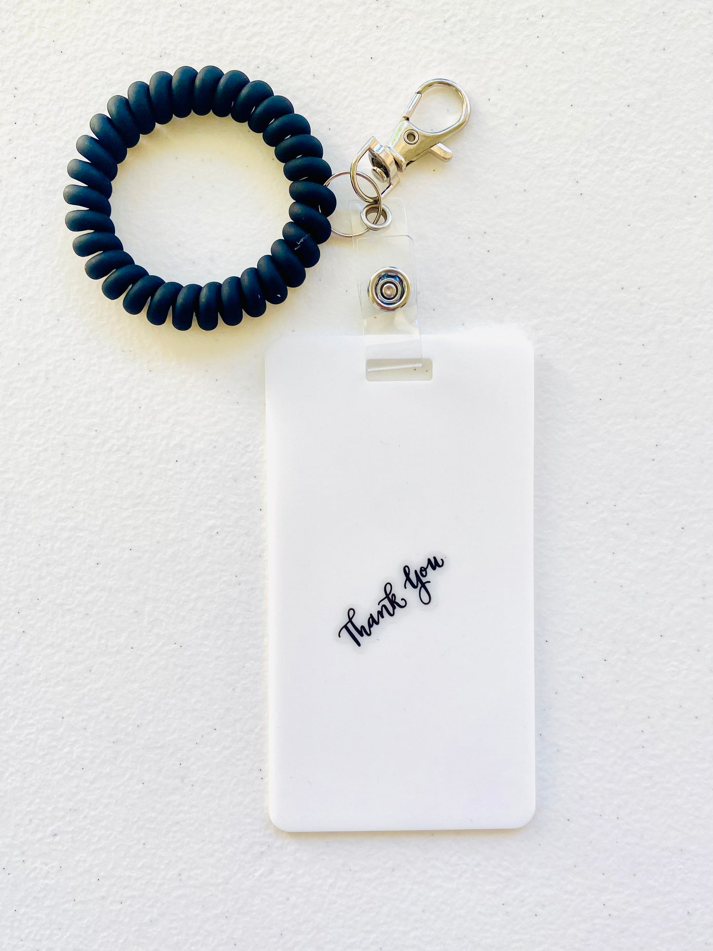 Keep your shopping list handy with this vertical reusable erasable badge note designed for keychains. Simply write using a ballpoint pen, erase with an alcohol pad, and reuse as needed. It easily clips onto your keys or purse, ensuring your list is always within reach. Please note, gel &amp; super smooth/color ballpoint inks could leave faint marks. This practical accessory offers a reliable way to stay organized on the go. www.badgenote.com