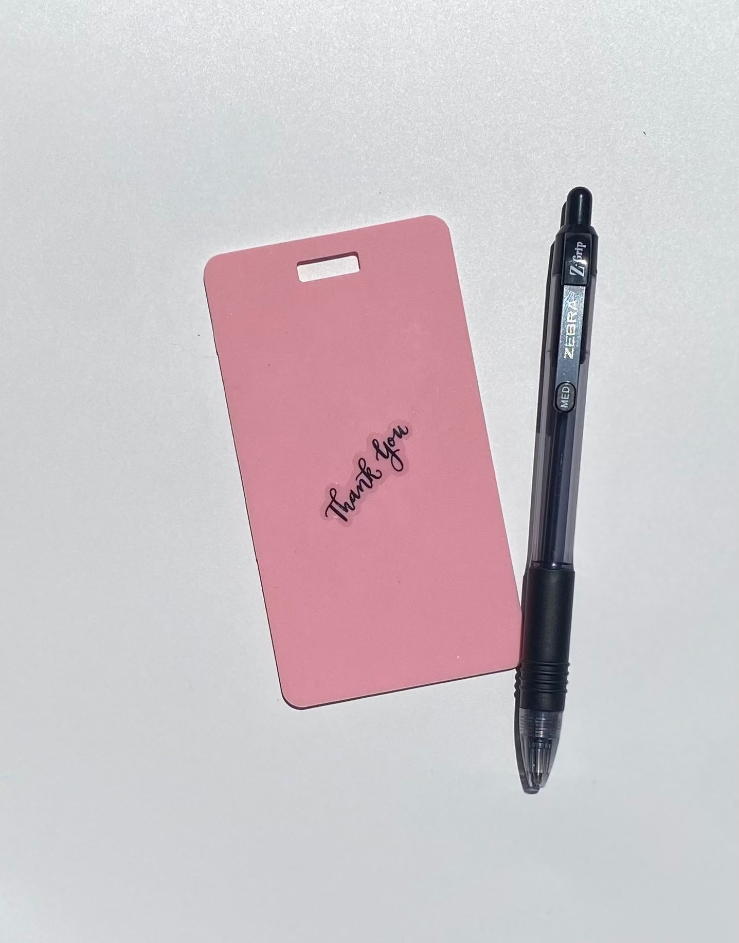 Ballpoint pen included. Vertical erasable badge is the perfect pocket-sized accessory for healthcare professionals. Easily write on it with ballpoint pen, wipe it clean with alcohol pad, and reuse. Made of lightweight soft silicone, it's a nurse's essential for taking notes on the go. Attach it to your ID badge for convenience. ATTENTION: Gel &amp; super smooth/colored ink will smudge and may leave faint stains.