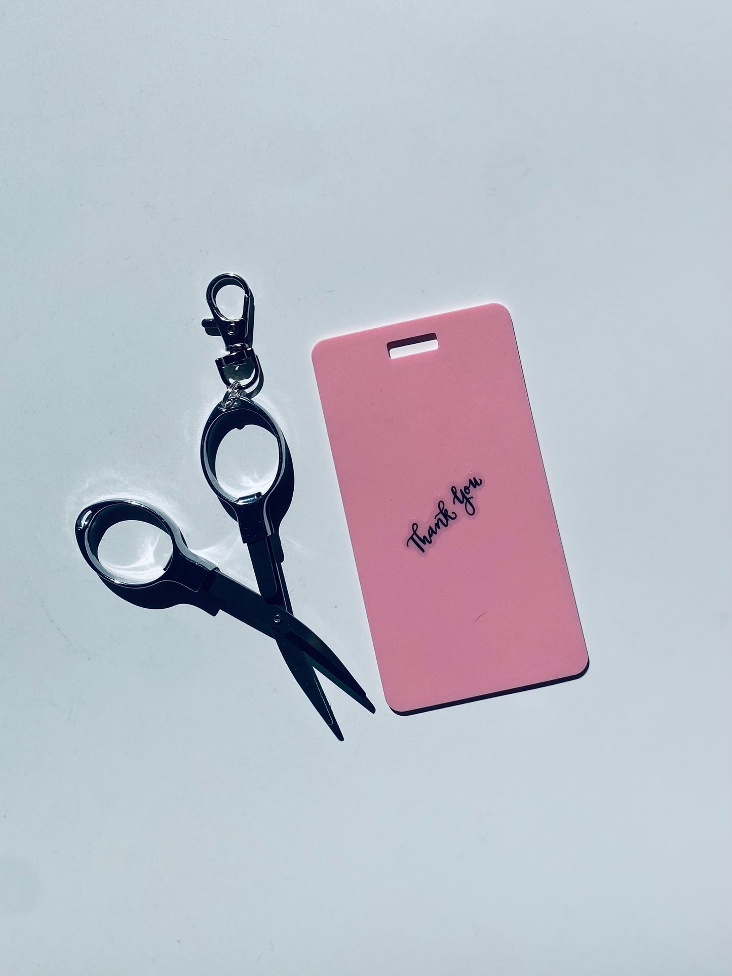 Vertical erasable badge with mini Scissors is the perfect pocket-sized accessory for healthcare professionals. Easily write on it with ballpoint pen, wipe it clean with alcohol pad, and reuse. Made of lightweight soft silicone, it's a nurse's essential for taking notes on the go. Attach it to your ID badge for convenience. ATTENTION: Gel &amp; super smooth/colored ink will smudge and may leave faint stains. www.badgemote.com