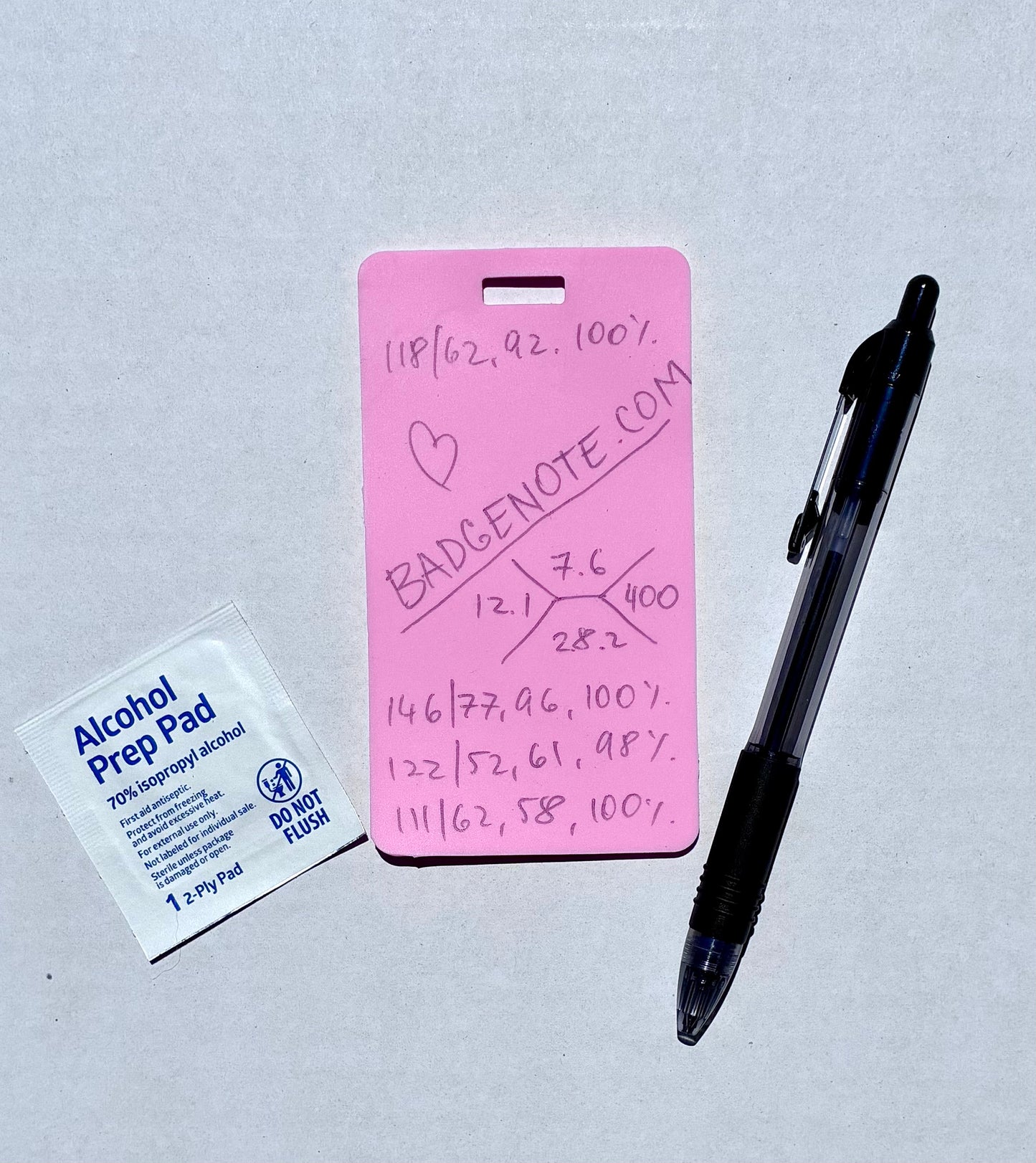 Ballpoint pen included. Vertical erasable badge is the perfect pocket-sized accessory for healthcare professionals. Easily write on it with ballpoint pen, wipe it clean with alcohol pad, and reuse. Made of lightweight soft silicone, it's a nurse's essential for taking notes on the go. Attach it to your ID badge for convenience. ATTENTION: Gel &amp; super smooth/colored ink will smudge and may leave faint stains. BADGENOTE.COM