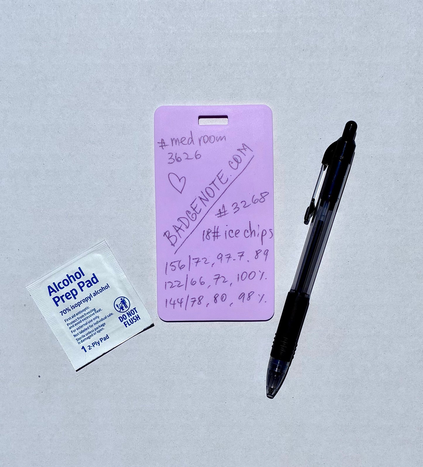 Ballpoint pen included. Vertical erasable badge is the perfect pocket-sized accessory for healthcare professionals. Easily write on it with ballpoint pen, wipe it clean with alcohol pad, and reuse. Made of lightweight soft silicone, it's a nurse's essential for taking notes on the go. Attach it to your ID badge for convenience. ATTENTION: Gel &amp; super smooth/colored ink will smudge and may leave faint stains. BADGENOTE.COM