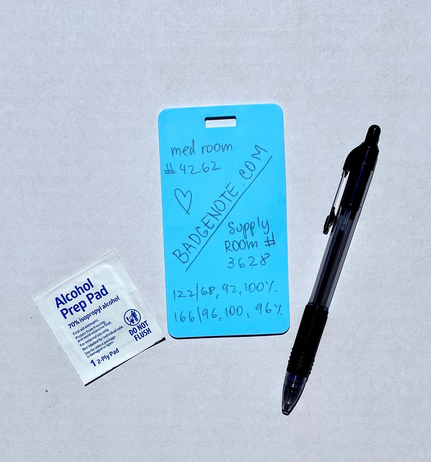 Ballpoint pen included. Vertical erasable badge is the perfect pocket-sized accessory for healthcare professionals. Easily write on it with ballpoint pen, wipe it clean with alcohol pad, and reuse. Made of lightweight soft silicone, it's a nurse's essential for taking notes on the go. Attach it to your ID badge for convenience. ATTENTION: Gel &amp; super smooth/colored ink will smudge and may leave faint stains. BADGENOTE.COM