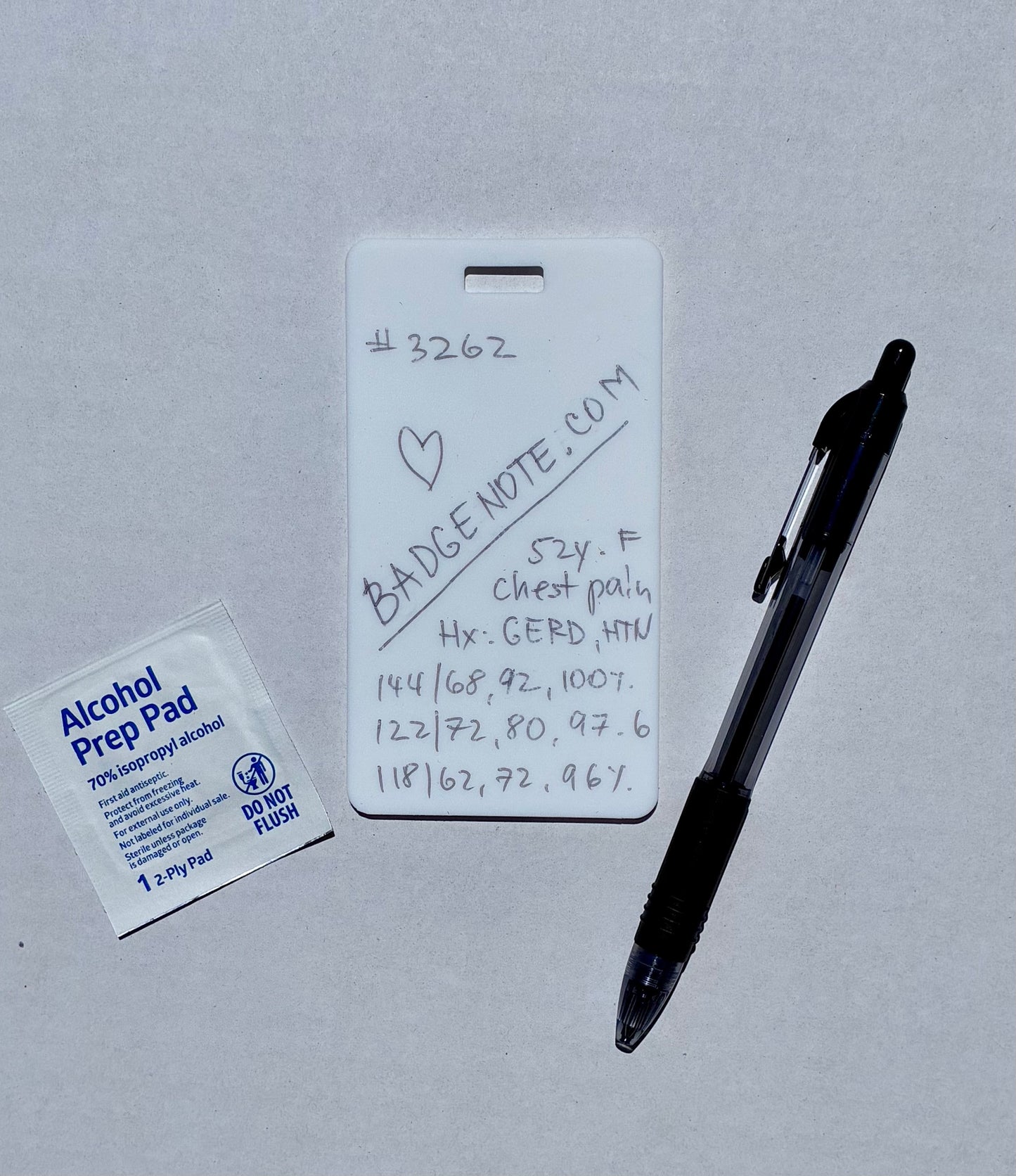 Ballpoint pen included. Vertical erasable badge is the perfect pocket-sized accessory for healthcare professionals. Easily write on it with ballpoint pen, wipe it clean with alcohol pad, and reuse. Made of lightweight soft silicone, it's a nurse's essential for taking notes on the go. Attach it to your ID badge for convenience. ATTENTION: Gel &amp; super smooth/colored ink will smudge and may leave faint stains. BADGENOTE.COM