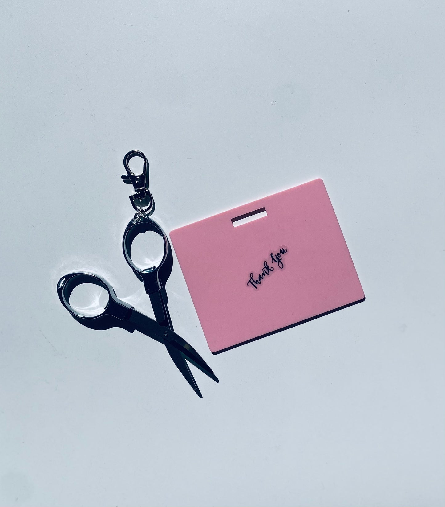 Horizontal erasable badge with mini Scissors is the perfect pocket-sized accessory for healthcare professionals. Easily write on it with ballpoint pen, wipe it clean with alcohol pad, and reuse. Made of lightweight soft silicone, it's a nurse's essential for taking notes on the go. Attach it to your ID badge for convenience. ATTENTION: Gel &amp; super smooth/colored ink will smudge and may leave faint stains. www.badgenote.com